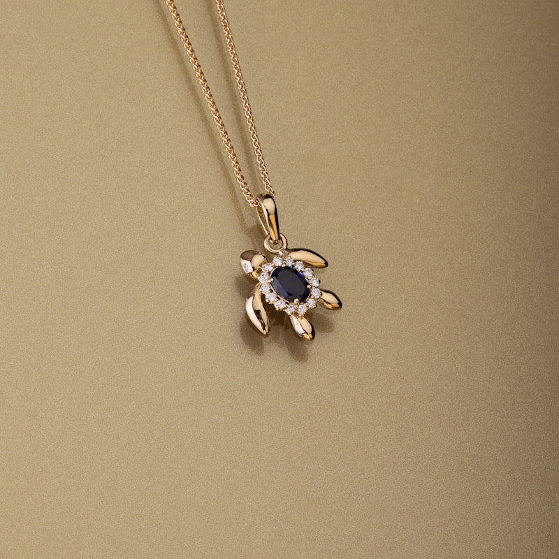 Gold 750 Sea turtle, oval shape blue sapphire and diamond pendant