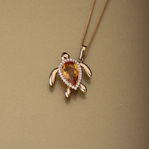 Gold 750 Sea turtle, pear shape topaz and diamond pendant